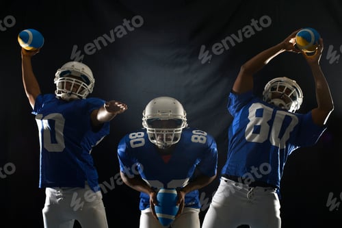 Preview: Studio composite shot of american footballer reaching for ball