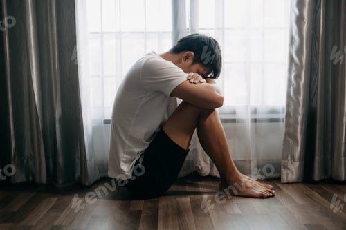 Preview: woman sit Depression Standing by window and anxiety Copy space.