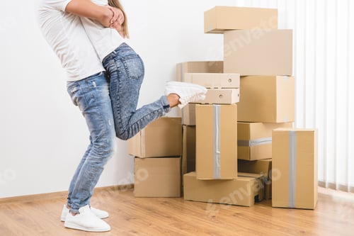 Preview: The man holds the woman the background of the carton boxes