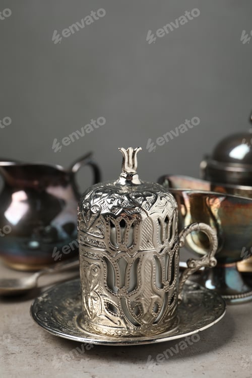 Preview: Vintage tea set on grey table, closeup. Space for text