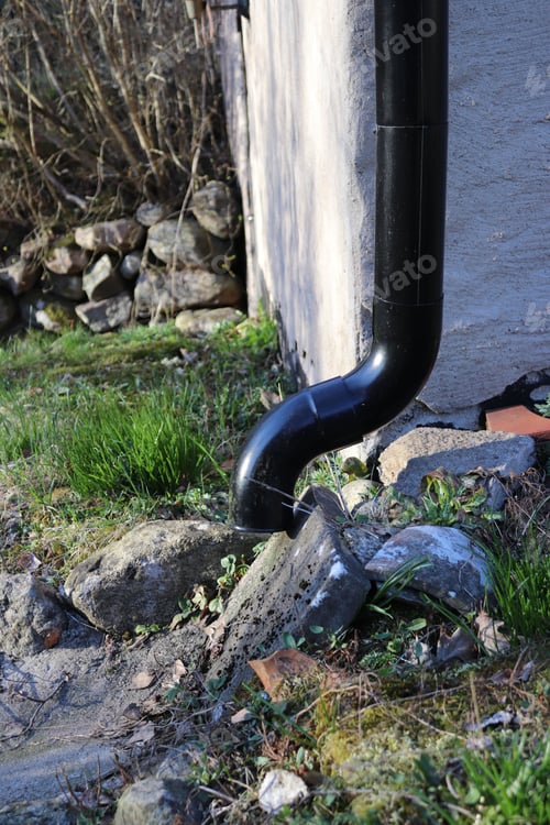 Preview: Vertical shot of a gutter Downspout on a wall