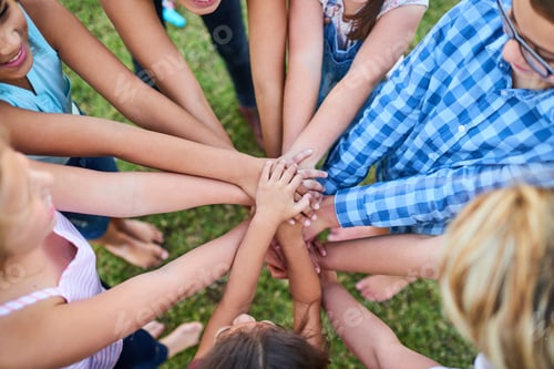 Preview: Kindness is power. Cropped shot of a group of kids stacking their hands on top of each other.