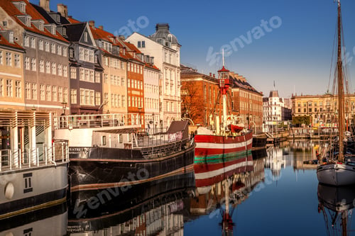 Preview: COPENHAGEN, DENMARK - MAY 6, 2018: buildings and moored boats in harbor