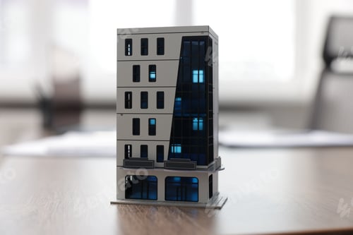 Preview: House model on desk in real estate agent's office, closeup