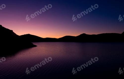Preview: Scenic sunrise over the mountain lake