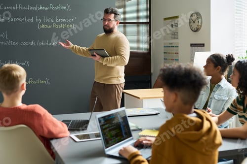 Preview: Caucasian Man Teaching Diverse Teenagers in Modern Classroom