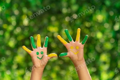 Preview: Happy child with smile on hands outdoor in spring