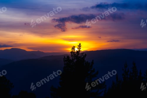Preview: Cloudy sunset sky over hills