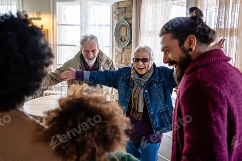 Preview: Happy multiethnic multi-generational family enjoying Christmas time together. People love concept.