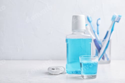 Preview: Oral care products and space for text on light background. Teeth hygiene