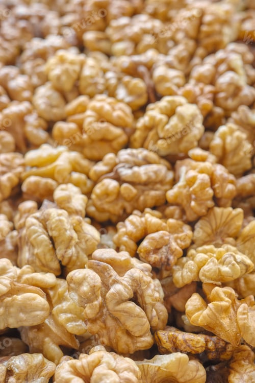 Preview: Close up photo of natural dried walnuts, selective focus, food background.