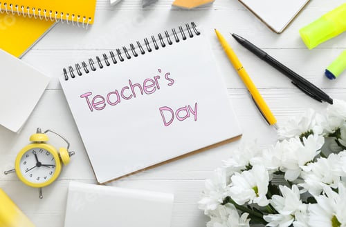 Preview: Flat lay composition with words TEACHER'S DAY, flowers and stationery on white wooden background