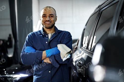 Preview: Portrait of African American man, car wash detailing service worker