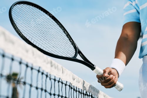 Preview: Cropped shot of an unrecognizable man holding a racket during a tennis match