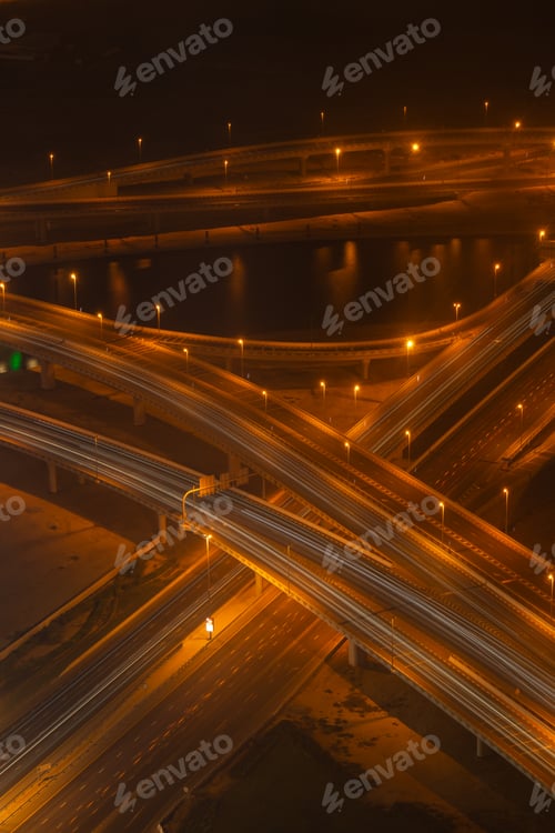 Preview: Detailed high angle shot of complex highway intersection at night