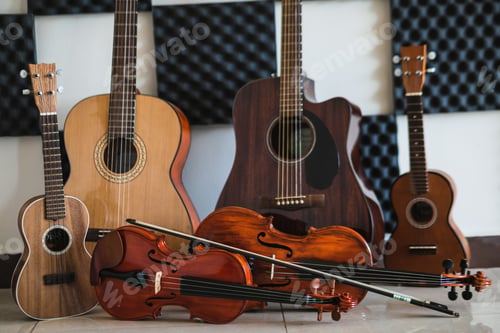 Preview: Row of different musical string instruments for a school of music