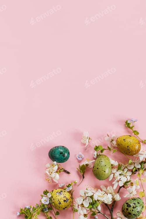 Preview: Stylish easter eggs and blooming flowers on pink background flat lay. Happy Easter!