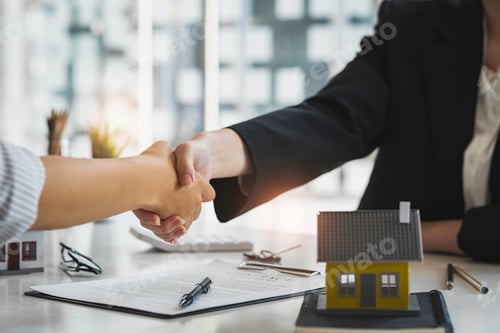 Preview: Successful deal Real estate lease or home purchase concept buyer shakes hands with bank employee aft