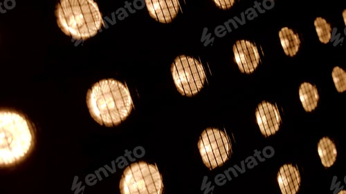 Preview: Bright orange lanterns. Stock footage.Bright lights on the ceiling that are fenced with a grid.