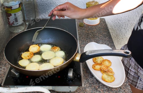 Preview: Cooking at home, fry zucchini in a pan