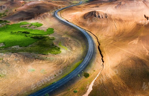 Preview: Aerial view on road in Iceland. Aerial landscape above highway in the geysers valley.