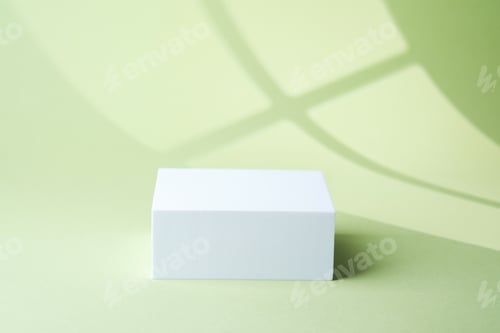 Preview: Minimal single white cube pedestal placed on pastel green background
