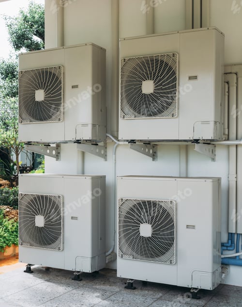 Preview: Four white air conditioners are mounted on a wall