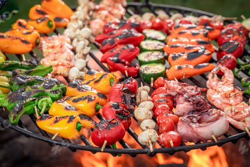 Preview: Healthy and tasty grilled shashlik on grill grate with fire.