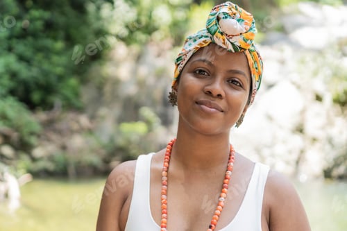 Preview: Portrait of African woman standing by the river