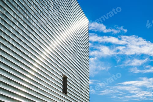 Preview: Closeup shot of the Kursaal Convention Center and Auditorium building under a blue cloudy sky