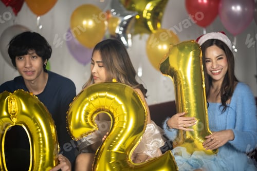 Preview: Happy Asian friends celebrating new year's eve 2021- people having fun together
