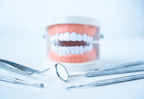 Preview: close up dentist tools for teeth care at white background top view