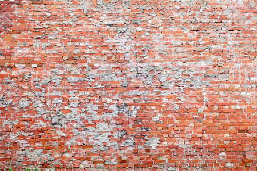 Preview: A Weathered Brick Wall with Patchy Mortar