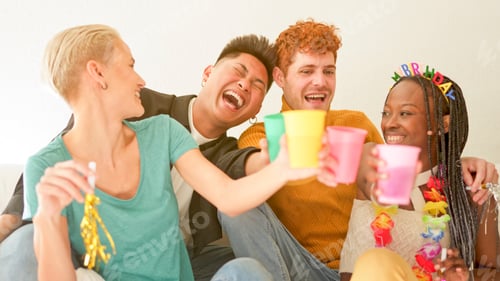 Preview: Friends toasting and laughing while celebrate at home