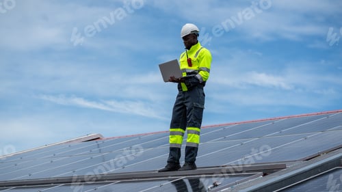 Preview: A service engineer inspects solar cells on the roof for maintenance, checking for any damaged parts.