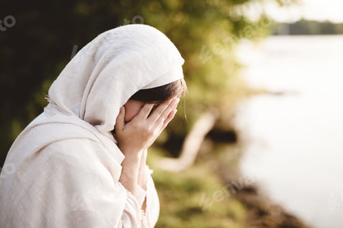 Preview: Closeup shot of a female wearing biblical robe crying - concept confessing sins