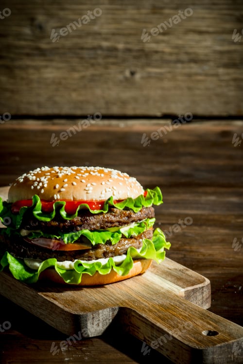 Preview: One Burger with beef,salad and vegetables.