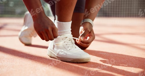 Preview: Person, hands and tying shoes with fitness for sport, workout or outdoor exercise on turf or court.