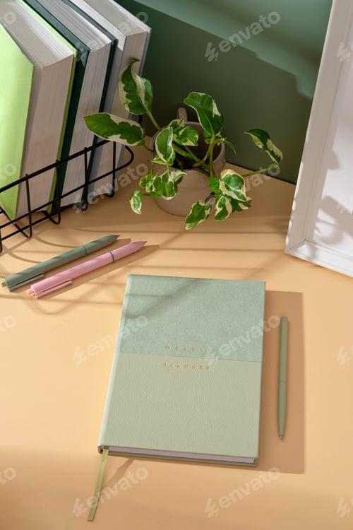 Preview: Elegant lightgreen weekly planner with stationery, sticky notes and organizing thoughts