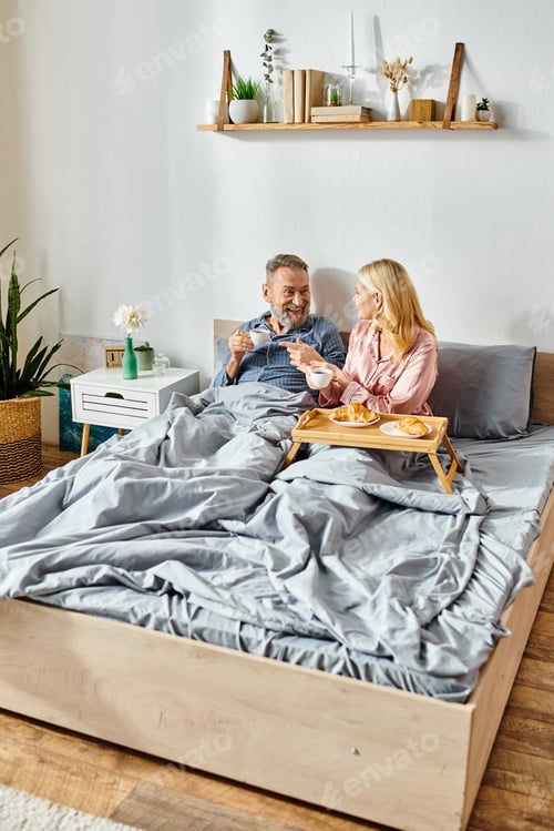 Preview: Intimate Moment: Couple Sitting Together on Bed