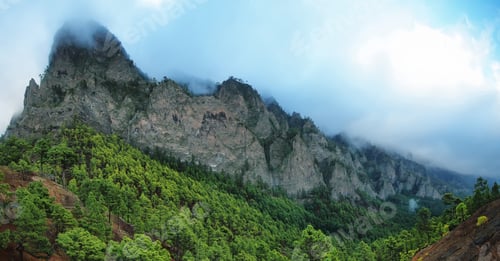 Preview: Tumbling clouds over a mountain ridge