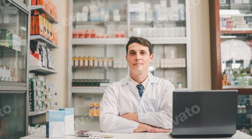 Preview: Male pharmacist posing confidently welcoming, advising patients and prescription patients