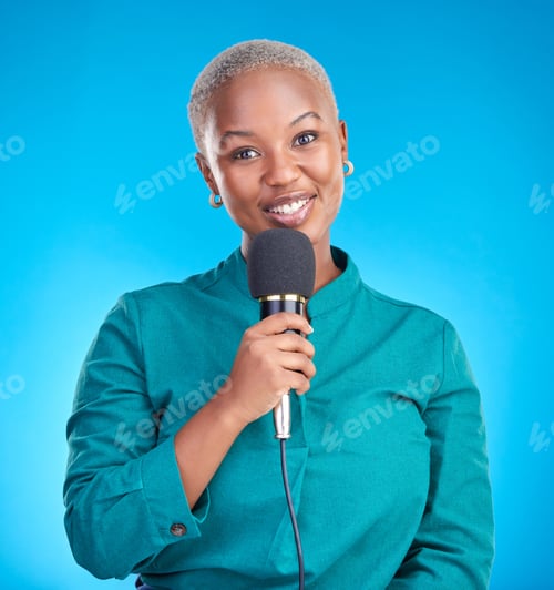 Preview: Reporter woman, smile and microphone in studio portrait for news, announcement or talk show by blue