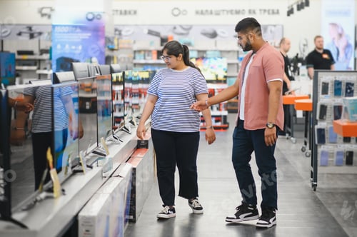 Preview: Couple in shopping. They are looking for new tv