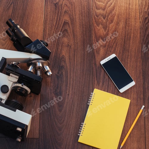 Preview: microscope image notebook and phone close-up.