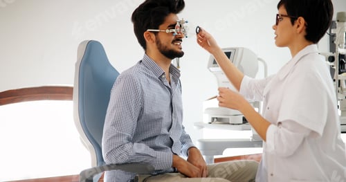 Preview: optometrist checking patient eyesight and vision correction