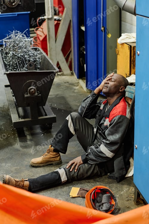 Preview: Wearied Factory Worker Resting During Break Time
