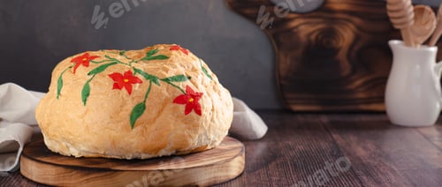 Preview: Loaf of bread hand painted with edible paints on a wooden board web banner