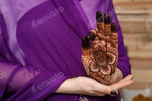 Preview: Woman with henna tattoo on palm, closeup and space for text. Traditional mehndi ornament
