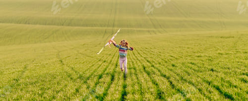 Preview: Beautiful little girl playing with kite